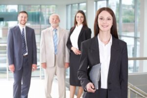 Beautiful woman on the background of business people